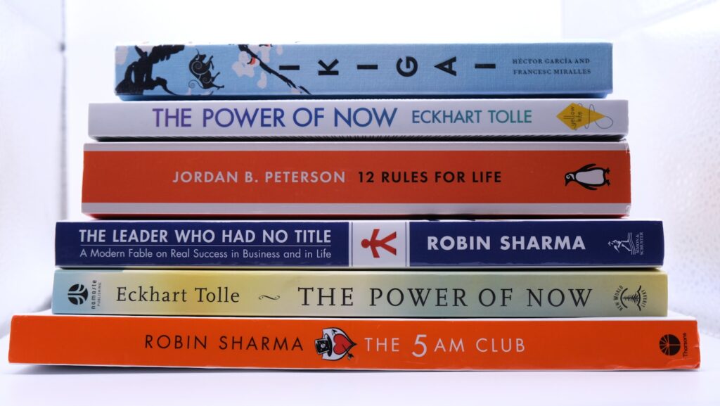 a stack of books sitting on top of each other